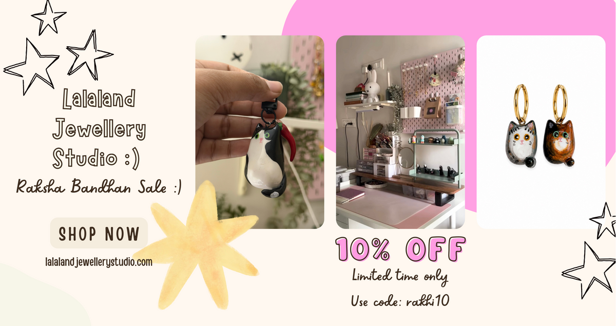 Promotional banner for Lalaland Jewellery Studio featuring a Raksha Bandhan sale offer. The graphic includes three product photos: a penguin-shaped pendant held by a hand, the interior of the jewelry studio, and a pair of cat-shaped earrings.